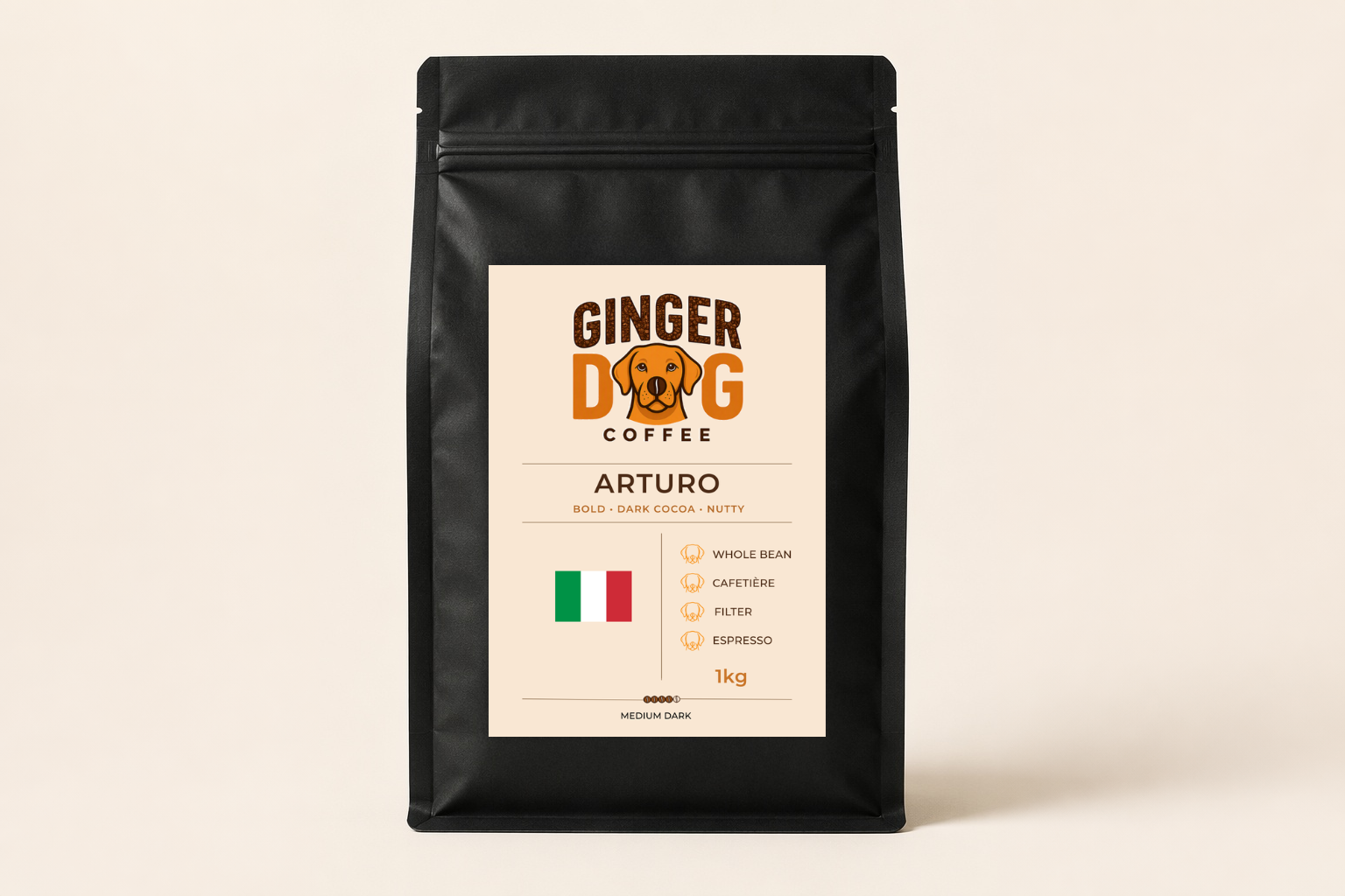 A black 1kg bag of Ginger Dog Coffee "Arturo" medium roast coffee displayed against a plain light background. The front label features the Ginger Dog Coffee logo, tasting notes of bold dark cocoa and nutty flavours, and an Italian flag graphic. Icons indicate the coffee is suitable for whole bean, cafetière, filter and espresso brewing methods. The packaging is shown in a clean, front-facing product photograph.