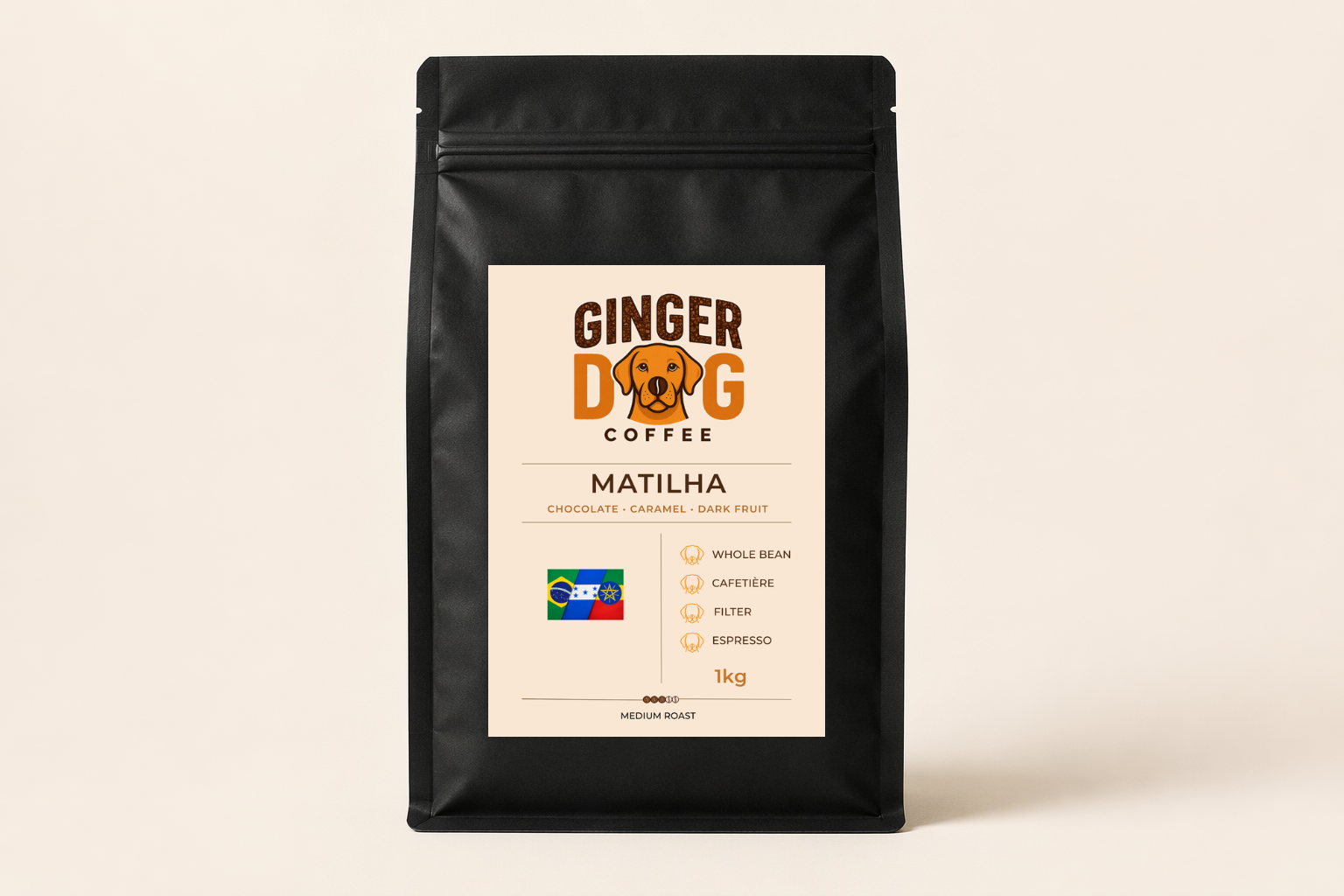 A black 1kg bag of Ginger Dog Coffee "Matilha" medium roast coffee displayed against a plain light background. The front label features the Ginger Dog Coffee logo, tasting notes of chocolate, caramel and dark fruit, and a Brazil-themed flag graphic. Icons indicate the coffee is suitable for whole bean, cafetière, filter and espresso brewing methods. The packaging is shown in a clear, front-facing product shot.