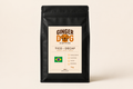 Tico Decaf speciality coffee beans by Ginger Dog Coffee in a 1kg black bag with Brazilian origin label and medium roast.