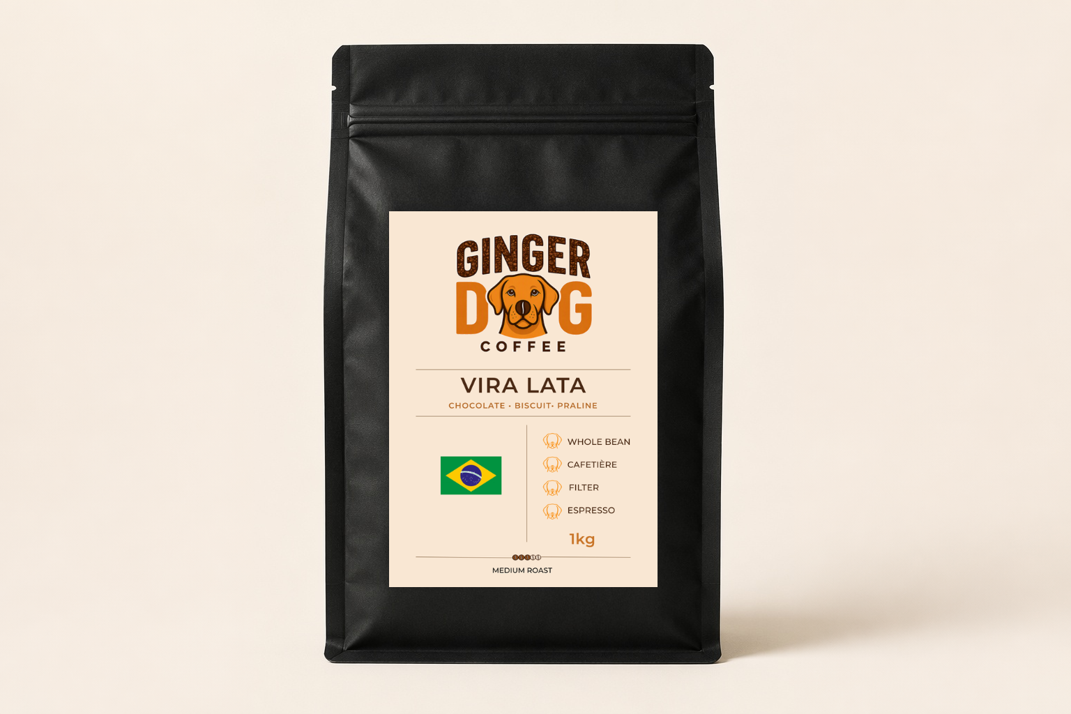 A black 1kg bag of Ginger Dog Coffee "Vira Lata" medium roast coffee displayed against a plain light background. The front label features the Ginger Dog Coffee logo, tasting notes of chocolate, biscuit and praline, and a Brazilian flag graphic. Icons indicate the coffee is suitable for whole bean, cafetière, filter and espresso brewing methods. The packaging is shown in a clean, front-facing product photograph.